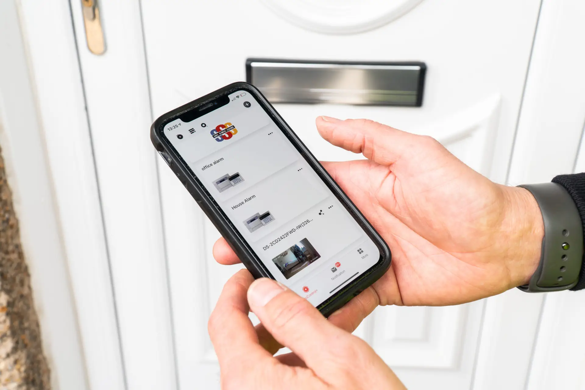 Safe Simple Secure's home alarm systems can be connected to your smartphone. Image shows alarm app on a phone.